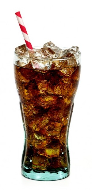 Cola beverage in glass with ice and striped straw on white background.